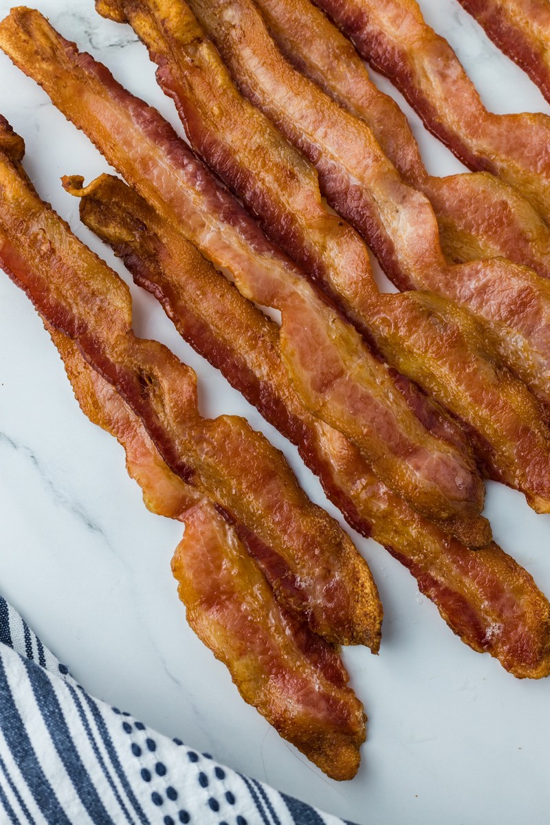https://www.southerncravings.com/wp-content/uploads/2020/04/Oven-Baked-Bacon-Featured-Image-1.jpg