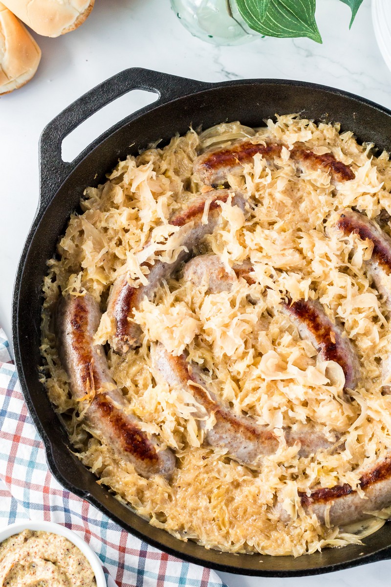 https://www.southerncravings.com/wp-content/uploads/2022/06/Beer-Braised-Bratwurst-in-Oven-Featured-Image.jpg